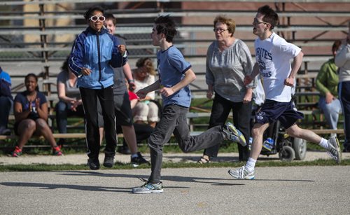 Teacher Bobbi Milberg's special education physical education class training on the field beside Grant Park Collegiate. Some of the intellectually challenged students will be taking part in this years provincial track and field championships. 150505 - Tuesday, May 05, 2015 -  (MIKE DEAL / WINNIPEG FREE PRESS)