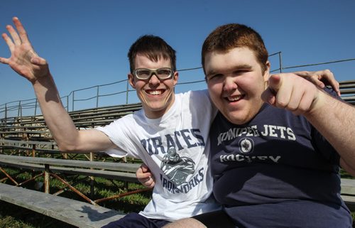 Ben Gunnarsson, 21(left), and Jack Funk, 17 (right) who are both in teacher Bobbi Milberg's special education physical education class training on the field beside Grant Park Collegiate. Some of the intellectually challenged students will be taking part in this years provincial track and field championships. 150505 - Tuesday, May 05, 2015 -  (MIKE DEAL / WINNIPEG FREE PRESS)