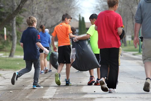 Grade 7 students from Bernie Wolfe School head into their neighbourhood of Transcona to do some spring cleaning Tuesday.  They were one school of several in the area participating in this event including Arthur Day Middle School, Calvin Christian Collegiate and many others who spread themselves out across Transcona to pick up litter and collect recyclables.  Standup photo   May 05, 2015 Ruth Bonneville / Winnipeg Free Press