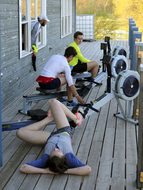 49.8 BORDERS - The Winnipeg Rowing Club. Emma Gray celebrates her 17th birthday by burning through a 6k RADAR test by Rowing Canada on the deck of the Winnipeg Rowing Club. Here she is on the bottom of the frame laying down after the are test.  BORIS MINKEVICH/WINNIPEG FREE PRESS May 5, 2015