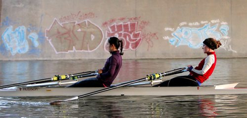 49.8 BORDERS - The Winnipeg Rowing Club. Hanika Nakagawa and Emily Lennox. Graffiti under the bridge in the back. St. Mary's road bridge. BORIS MINKEVICH/WINNIPEG FREE PRESS May 5, 2015