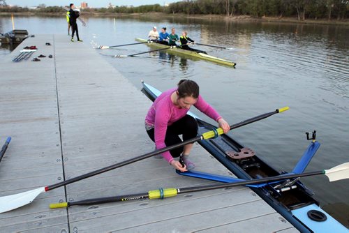 49.8 BORDERS - The Winnipeg Rowing Club. Launching at the crack of dawn.Drew Wiebe sorts out her oar on the dock. BORIS MINKEVICH/WINNIPEG FREE PRESS May 5, 2015