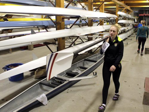 49.8 BORDERS - The Winnipeg Rowing Club. Bridget Burns helps get the oars out. BORIS MINKEVICH/WINNIPEG FREE PRESS May 5, 2015