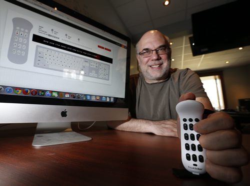 Tony Havelka, pres. Tek Gear Inc. holds his  mobile, wireless keyboard called the Twiddler. On the screen is the Twiddler tutor to practice using the device.  Martin Cash story.  Wayne Glowacki / Winnipeg Free Press May 5 2015