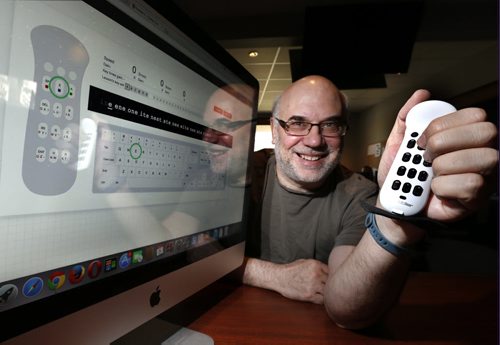 Tony Havelka, pres. Tek Gear Inc. holds his mobile, wireless keyboard called the Twiddler. On the screen is the Twiddler tutor to practice using the device. Martin Cash story.  Wayne Glowacki / Winnipeg Free Press May 5 2015