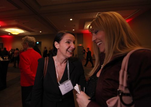 Chris Albi, a nominee for Public Awareness & Media Communications in this year's Women of Distinction awards, talks to her co-worker, Shannon Shushkewich during the awards nights at the Convention Centre Wednesday.   May 06, 2015 Ruth Bonneville / Winnipeg Free Press