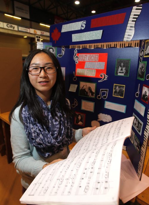 Local - history projects - Duckworth centre at UofW, students display their history projects for provincial heritage fair. Arthur Leach School - Pembina Trails School Division - Jennifer Luo project on music history. BORIS MINKEVICH/WINNIPEG FREE PRESS May 7, 2015