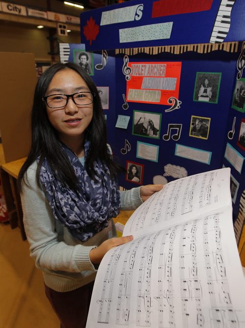 Local - history projects - Duckworth centre at UofW, students display their history projects for provincial heritage fair. Arthur Leach School - Pembina Trails School Division - Jennifer Luo project on music history. BORIS MINKEVICH/WINNIPEG FREE PRESS May 7, 2015