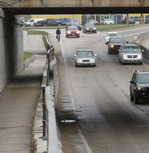 Mark Cohoe,executive director of  Bike Winnipeg rides through the Pembina Highway Underpass. This is part of the launch of readers submitting cycling trouble spots.Kristin Annable  story.  Wayne Glowacki / Winnipeg Free Press May 7 2015
