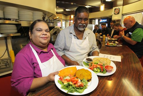 Famena's Famous Roti - 295 Garry Street. Sanderson story. L-R Famena and Mohammed Ally run the restaurant.  Here they show off some of their good food. BORIS MINKEVICH/WINNIPEG FREE PRESS May 7, 2015