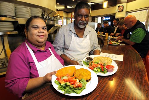 Famena's Famous Roti - 295 Garry Street. Sanderson story. L-R Famena and Mohammed Ally run the restaurant.  Here they show off some of their good food. BORIS MINKEVICH/WINNIPEG FREE PRESS May 7, 2015