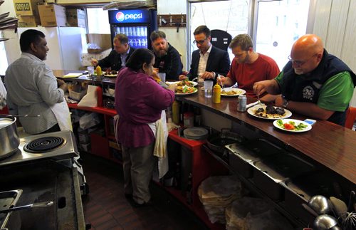 Famena's Famous Roti - 295 Garry Street. Sanderson story. (L-R behind counter) Mohammed and Famena Ally own the restaurant. BORIS MINKEVICH/WINNIPEG FREE PRESS May 7, 2015