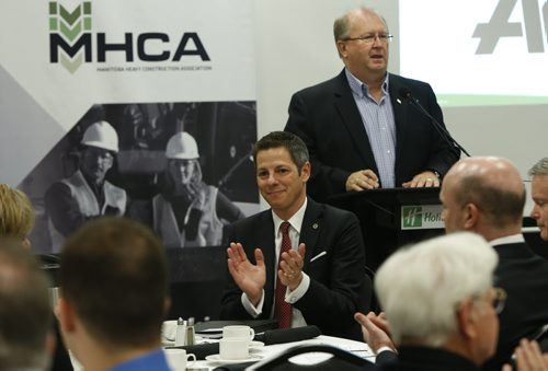 Mayor Brian Bowman and Chris Lorenc,  president of the Manitoba Heavy Construction Association at podium during the MHCA Breakfast Friday.  The Mayor was the speaker for their Leaders Series.  Murray McNeill story.  Wayne Glowacki / Winnipeg Free Press May 8 2015