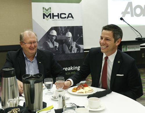 At right, Mayor Brian Bowman and Chris Lorenc,  president of the Manitoba Heavy Construction Association at the MHCA Breakfast Friday.  The Mayor was the speaker for their Leaders Series.  Murray McNeill story.  Wayne Glowacki / Winnipeg Free Press May 8 2015