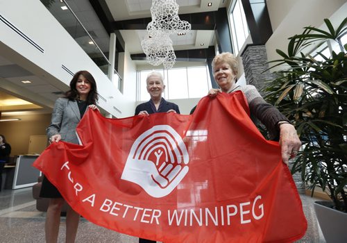 United Way.   From left, Connie Walker, current CEO of United Way of Winnipeg, Susan Lewis, former longtime CEO and Carol McGonigal who volunteered with the Community Chest and early days of United Way with flag in the United Way building.  Kevin Rollason's United Way history  story.  Wayne Glowacki / Winnipeg Free Press May 8 2015
