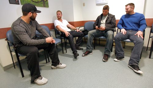Left to right, Winnipeg Goldeye's Rob Nixon, Brad Boyer CJ Ziegler  and Adam Heisler wait in line for medicals at the Pan Am Clinic Friday Morning. See story.  May 8, 2015 - (Phil Hossack / Winnipeg Free Press)