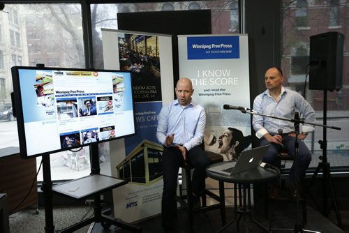At the Winnipeg Free Press News Cafe Friday,  Christian Panson, V.P Digital Content and Audience Revenue at left with Paul Samyn, Winnipeg Free Press Editor give a sneak preview of  the paper's  new website. Wayne Glowacki / Winnipeg Free Press May 8 2015