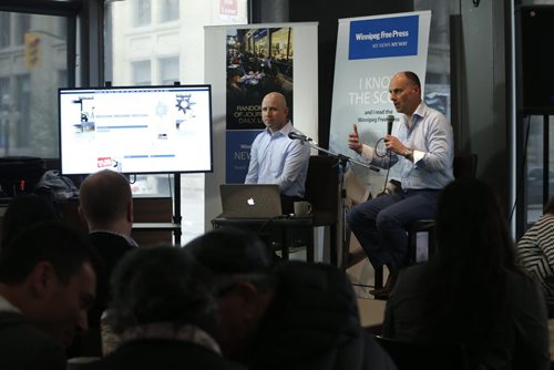 At the Winnipeg Free Press News Cafe Friday,  Christian Panson, V.P Digital Content and Audience Revenue with Paul Samyn, Winnipeg Free Press Editor at right  give a sneak preview of  the paper's  new website. Wayne Glowacki / Winnipeg Free Press May 8 2015