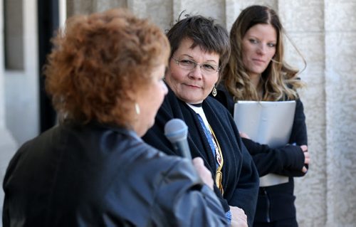 Ginny Kirk, who leads the Justice for Tim McLean and Carol de Delley, middle, mother of Tim McLean, at a rally at the Manitoba Legislative Building to protest against Li's request to be transferred to a group home in the city, Saturday, May 9, 2015. (TREVOR HAGAN/WINNIPEG FREE PRESS)