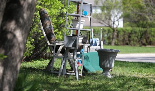 An eclectic array of garden supplies sits on a curb on Assiniboine Ave. Saturday for the free weekend giveaway event that is on this weekend.   May 09, 2015 Ruth Bonneville / Winnipeg Free Press