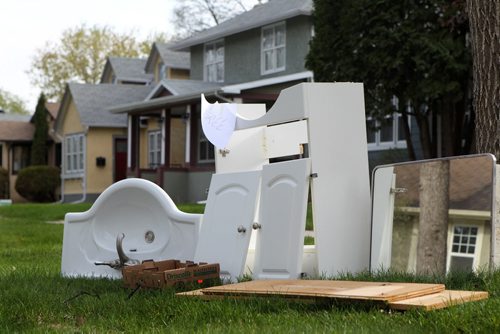 A bathroom sink and cupboards sit a on a curb in River Heights Saturday for the free weekend giveaway event that is on this weekend.   May 09, 2015 Ruth Bonneville / Winnipeg Free Press