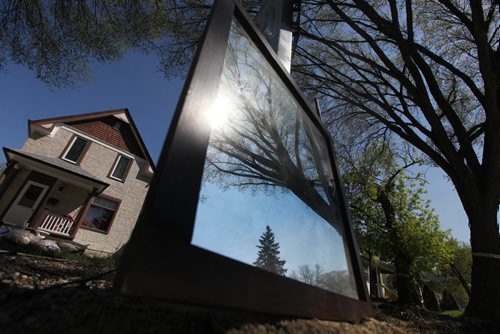 A mirror from a dresser is proper against a pole near the  curb in Wolsely Saturday for the free weekend giveaway event that is on this weekend.   May 09, 2015 Ruth Bonneville / Winnipeg Free Press