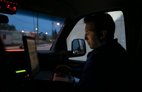 Police Cadet Adam Krasnesky inputing information at 75 Martha Street, for Katie May story, Friday, May 8, 2015. (TREVOR HAGAN/WINNIPEG FREE PRESS)