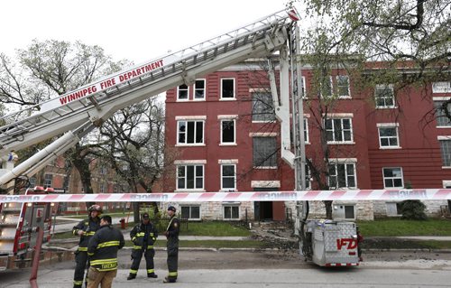 Winnipeg Police still have Bannatyne Ave. at Juno St.  closed to traffic Monday morning as a fire crew is still on the scene at the Bannatyne Apartments after a fire broke out Sunday. Wayne Glowacki / Winnipeg Free Press May 11  2015