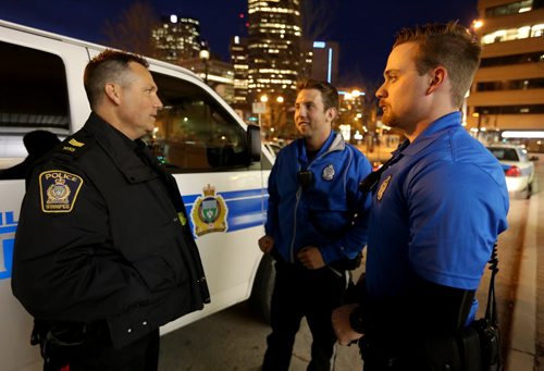 Patrol Sgt. Gary Mathez speaks to Police Cadet Adam Krasnesky and Cadet Josh Mrochuk, for Katie May story, Friday, May 8, 2015. (TREVOR HAGAN/WINNIPEG FREE PRESS)