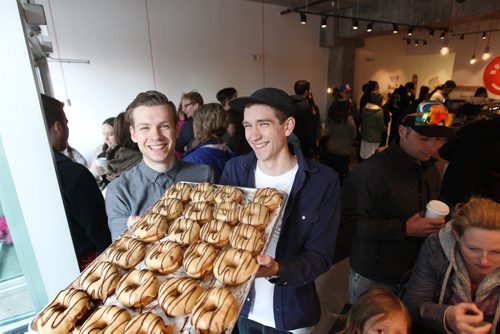 Intersection piece on Bronuts - Winnipeg's first, dedicated gourmet doughnut shop owned by Brett (left) and Dylan Zahari - brothers who put the Bro in Bronuts.  Brothers hold tray of peanut butter, chocolate Bronuts inside their cafe on a busy Saturday morning.   May 09, 2015 Ruth Bonneville / Winnipeg Free Press