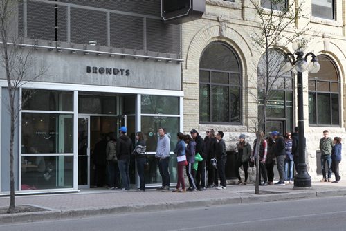 Intersection piece on Bronuts - Winnipeg's first, dedicated gourmet doughnut shop owned by Brett (left) and Dylan Zahari - brothers who put the Bro in Bronuts.  People lineup down the block on a  early Saturday morning.   May 09, 2015 Ruth Bonneville / Winnipeg Free Press