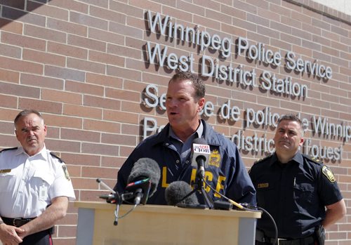 LOCAL POLICE - Media briefing on Project Comet, to combat on-going spikes in property-related crime.  Left to right - Inspector Rick Guyader, Sergeant Mike Brooker, and Constable Jason Michalyshen. BORIS MINKEVICH/WINNIPEG FREE PRESS May 12, 2015
