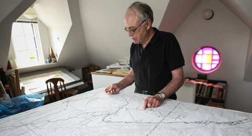Real Berard, artist, canoe route mapper and political cartoonist at his home in Winnipeg working on one of his many map projects. 150512 - Tuesday, May 12, 2015 -  (MIKE DEAL / WINNIPEG FREE PRESS)