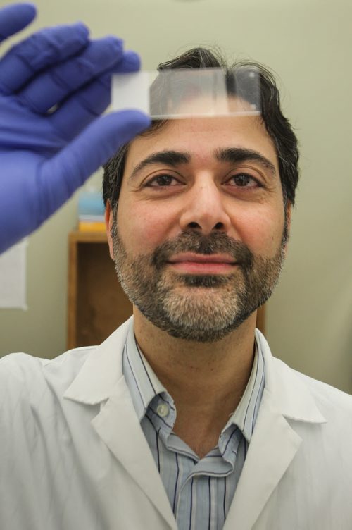 University of Manitoba Professor Afshin Raouf is a researcher who specializes in isolating and assessing healthy breast cells and cancer cells. Professor Raouf holds a viewing slide with breast cells. 150512 - Tuesday, May 12, 2015 -  (MIKE DEAL / WINNIPEG FREE PRESS)