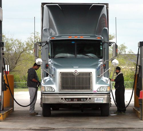 Truckers re-fuel their rig Tuesday in Winnipeg. See story re: fuel prices. May 12, 2015 - (Phil Hossack / Winnipeg Free Press)