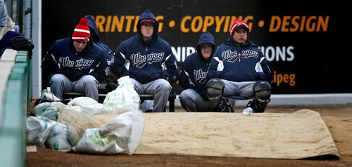 Winnipeg Goldeye's Bullpen fights to stay off the chills Wednesday night during a cool pre-season game against Fargo's Redhawks at Shaw Park. May 13, 2015 - (Phil Hossack / Winnipeg Free Press)