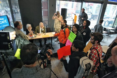 An environmental group disrupts the Winnipeg Free Press editorial board interview with Peter Watson the NEB Chair being held at the Winnipeg Free Press NewsCafe.  150514 May 14, 2015 Mike Deal / Winnipeg Free Press