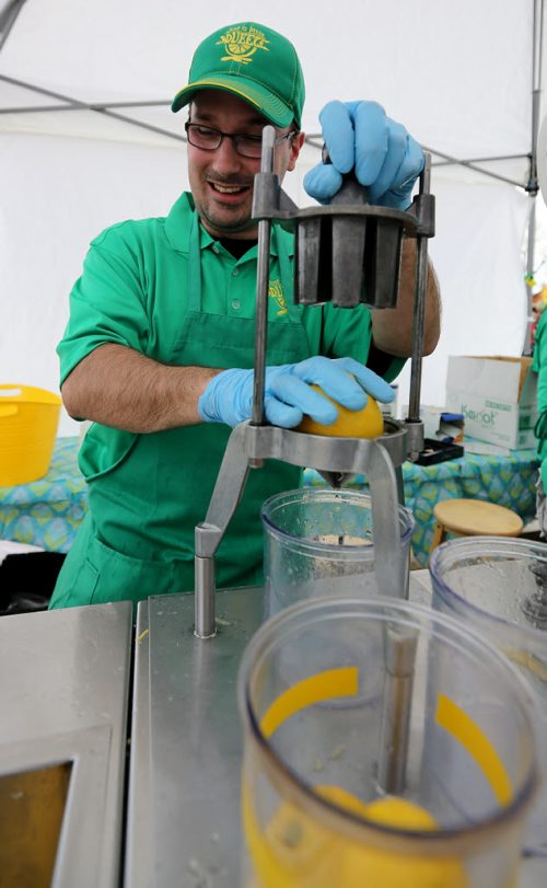 Joël Bouchard of Just a Little Squeeze prepares fresh Lemonade at The St.Norbert Farmers Market, May 16, 2015. (TREVOR HAGAN/WINNIPEG FREE PRESS)