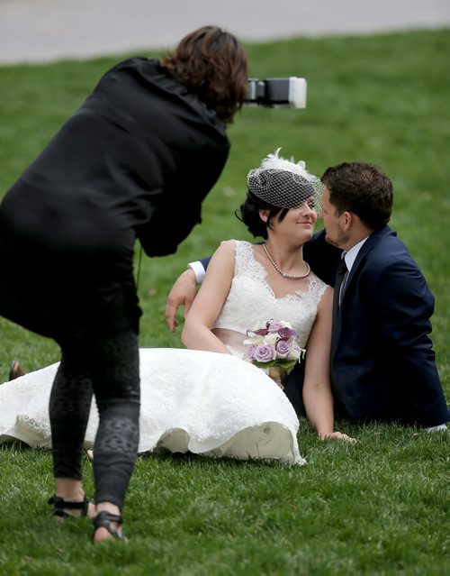 Candace Brodeur and Duane Gitzel have wedding photos taken by Krista Anderson in Old Market Square, Saturday, May 16, 2015. (TREVOR HAGAN/WINNIPEG FREE PRESS)