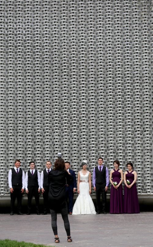 Candace Brodeur and Duane Gitzel have wedding photos taken by Krista Anderson in Old Market Square, Saturday, May 16, 2015. (TREVOR HAGAN/WINNIPEG FREE PRESS)