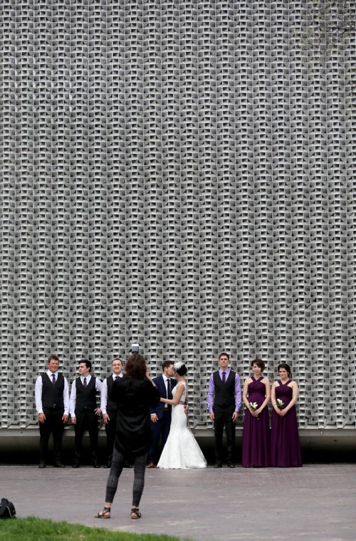 Candace Brodeur and Duane Gitzel have wedding photos taken by Krista Anderson in Old Market Square, Saturday, May 16, 2015. (TREVOR HAGAN/WINNIPEG FREE PRESS)