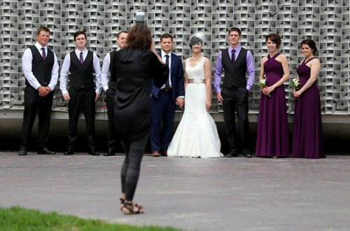 Candace Brodeur and Duane Gitzel have wedding photos taken by Krista Anderson in Old Market Square, Saturday, May 16, 2015. (TREVOR HAGAN/WINNIPEG FREE PRESS)