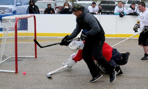 Goaltender Shane Dawson of Just Shoot sprawls to stop Desmond Lavalle of the High Flyers during the Play On! 4 on 4 Street Hockey Tournament at the University of Manitoba, Sunday, May 17, 2015. (TREVOR HAGAN/WINNIPEG FREE PRESS)