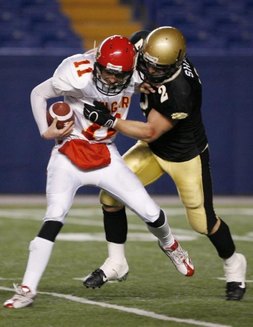 John Woods / Winnipeg Free Press / Nov 3/07- 071103  - Clayton Masikewich (11) of the Calgary Dinos is sacked by the Manitoba Bisons Justin Shaw (2) in the second half of their semi final game in Winnipeg Saturday Nov 3/07.