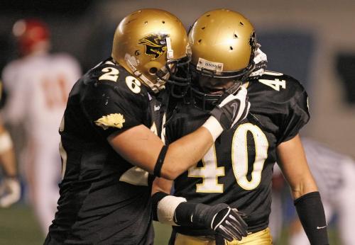 John Woods / Winnipeg Free Press / Nov 3/07- 071103  - Manitoba Bisons Brady Browne (40) is congratulated by Bob Reist (26) after Browne intercepted a Calgary Dino pass in the second half of their semi final game in Winnipeg Saturday Nov 3/07.
