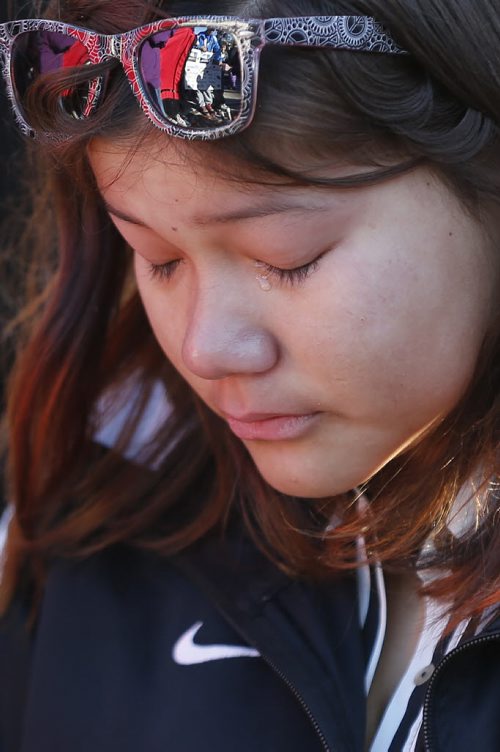 May 18, 2015 - 150518  -  A female teen weeps at a vigil for Teresa Robinson. On Monday, May 18, 2015 people gathered at the Oodena Circle at the Forks for a vigil for Teresa Robinson, an eleven year old who was killed on the first nation community of Garden Hill. John Woods / Winnipeg Free Press