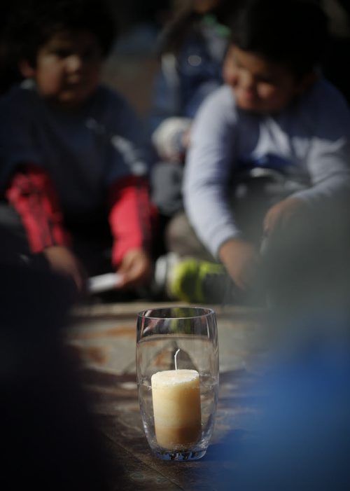 May 18, 2015 - 150518  -  Young children gather around a vigil candle for Teresa Robinson. On Monday, May 18, 2015 people gathered at the Oodena Circle at the Forks for a vigil for Teresa Robinson, an eleven year old who was killed on the first nation community of Garden Hill. John Woods / Winnipeg Free Press