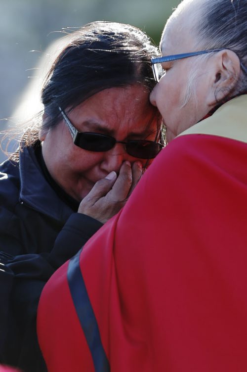 May 18, 2015 - 150518  -  A family member weeps at a vigil for Teresa Robinson. On Monday, May 18, 2015 people gathered at the Oodena Circle at the Forks for a vigil for Teresa Robinson, an eleven year old who was killed on the first nation community of Garden Hill. John Woods / Winnipeg Free Press