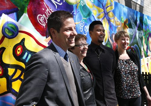 From left, Mayor Brian Bowman,  Children and Youth Opportunities Minister Melanie Wight, Bob Veruela Jr., program director and Graffiti Art and Julia Wake, project co-ordinator, st.ART, Graffiti Art at the provincial announcement Tuesday at the Norquay Community Centre the province will invest $1.5 million to fund enhanced youth recreation programs in inner-city neighbourhoods.   see prov. gov't release. Wayne Glowacki / Winnipeg Free Press May 19 2015
