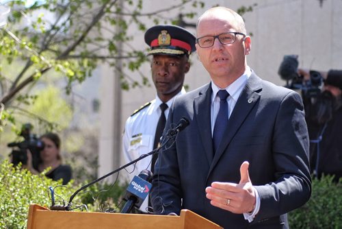 Winnipeg City Councillor Scott Gillingham, Chair of the Winnipeg Police Board, and Winnipeg Police Chief Devon Clunis announce the 2015-2019 Winnipeg Police Service Strategic Plan outside City Hall Tuesday afternoon.  150519 May 19, 2015 Mike Deal / Winnipeg Free Press